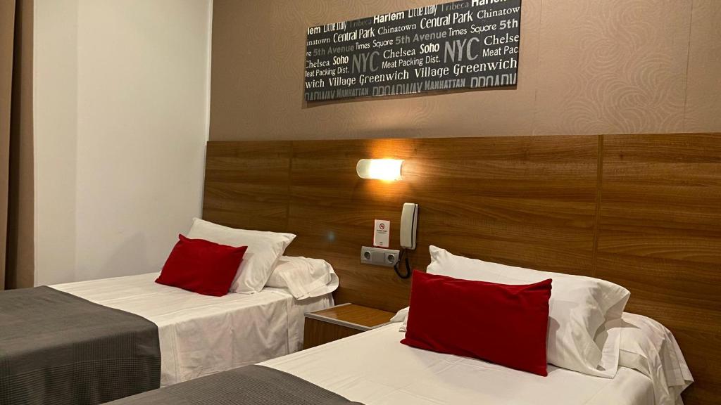 Postel nebo postele na pokoji v ubytování Hostal San Francisco