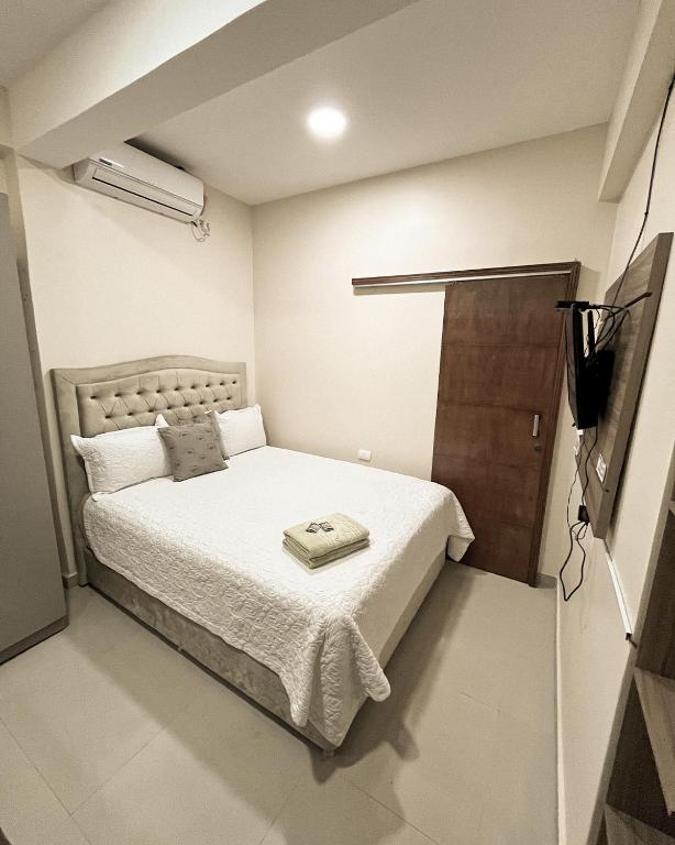 Postel nebo postele na pokoji v ubytování Darling Hotel Ciudad del Este