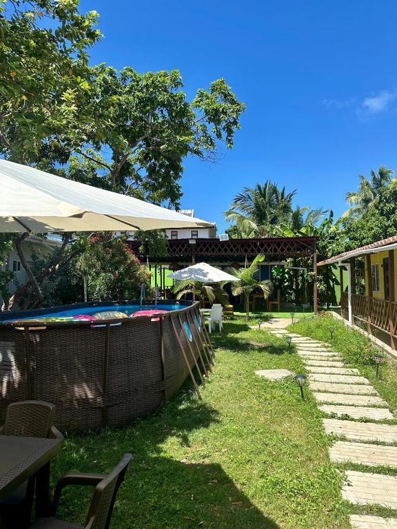 Um jardim em Eco-Hotel Palma É Coco