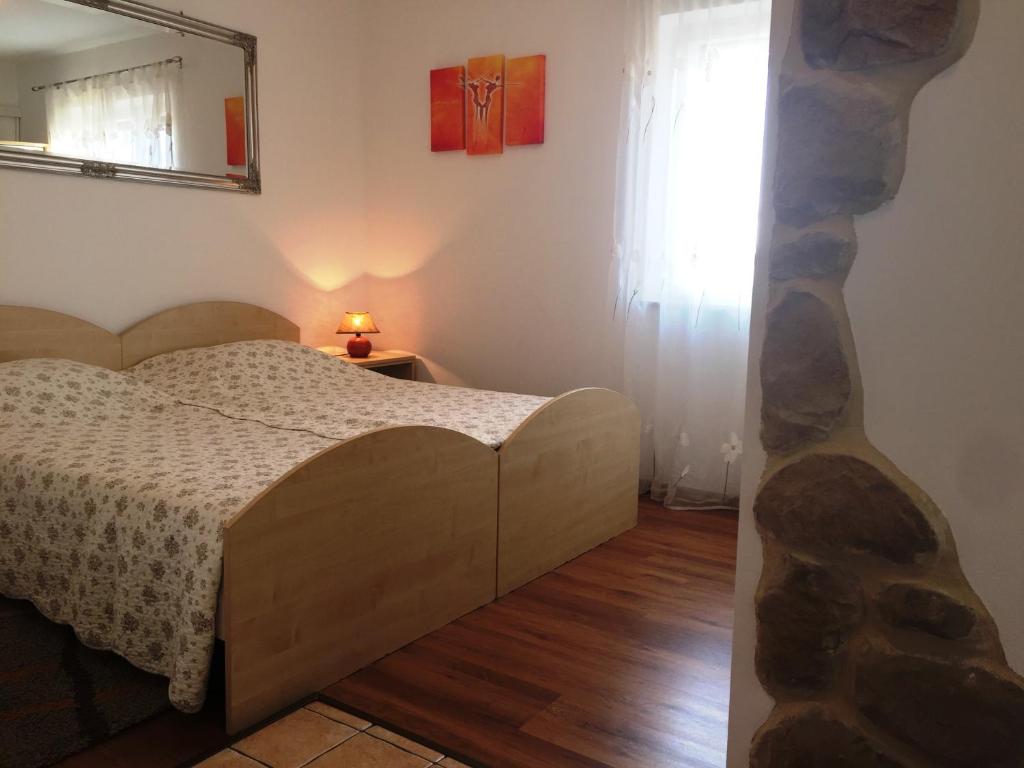 Posteľ alebo postele v izbe v ubytovaní Apartments Ana+3