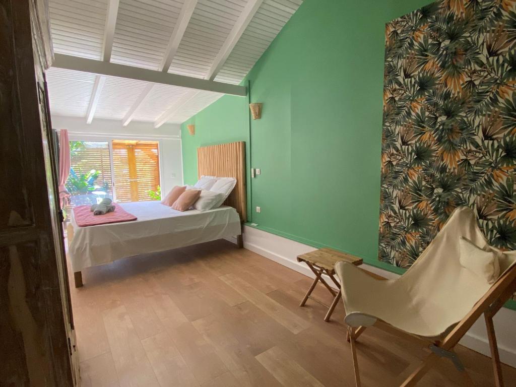 Postel nebo postele na pokoji v ubytování Villa bleu karaïbes