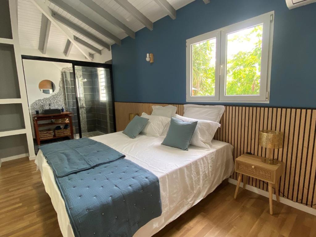 Postel nebo postele na pokoji v ubytování Villa bleu karaïbes