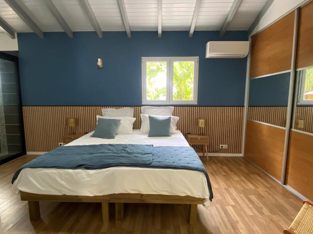 Postel nebo postele na pokoji v ubytování Villa bleu karaïbes
