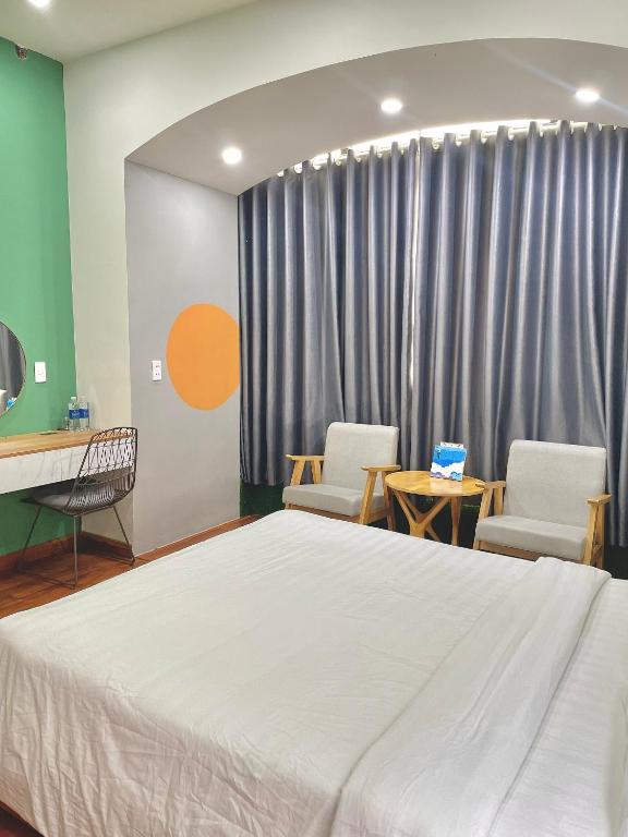 Postel nebo postele na pokoji v ubytování POTA Hotel & Apartment
