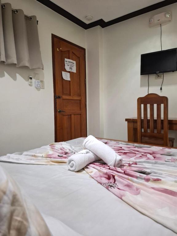 Postel nebo postele na pokoji v ubytování Citrine Tourist Inn
