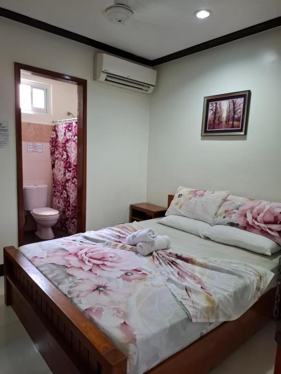 Postel nebo postele na pokoji v ubytování Citrine Tourist Inn