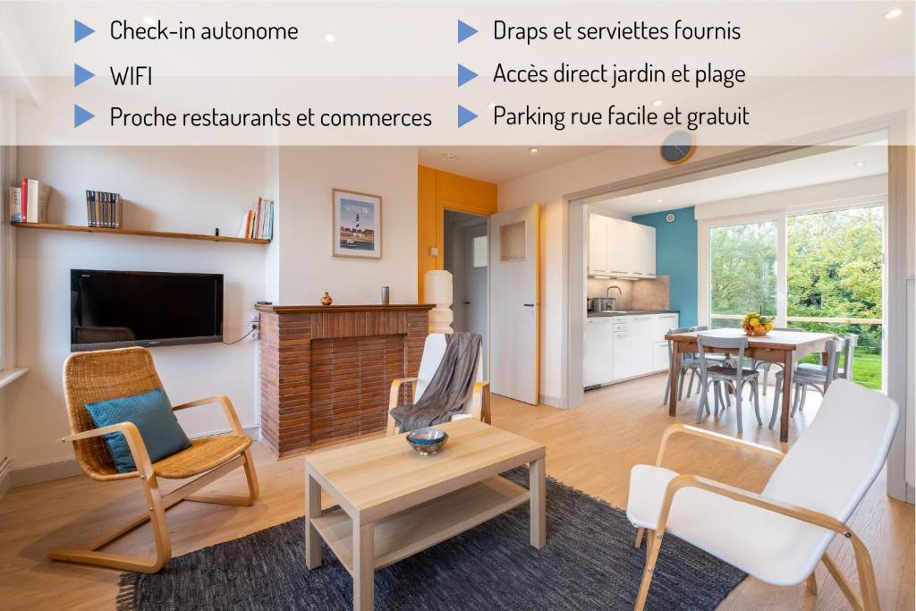 a living room with a table and a dining room at Rafale 1er étage - Accès Privée à la plage in Grand-Fort-Philippe