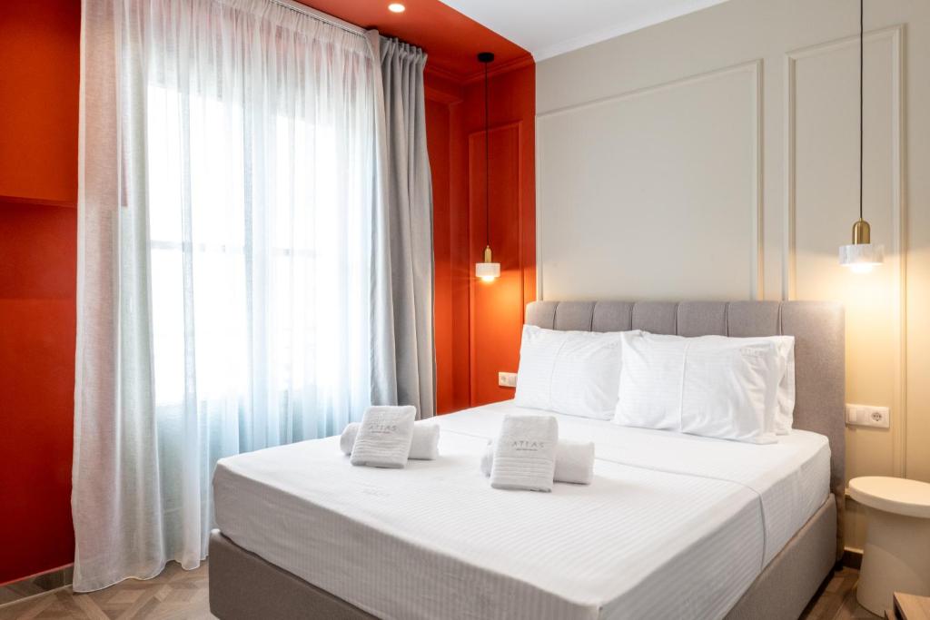 Postel nebo postele na pokoji v ubytování Atlas Boutique Suites