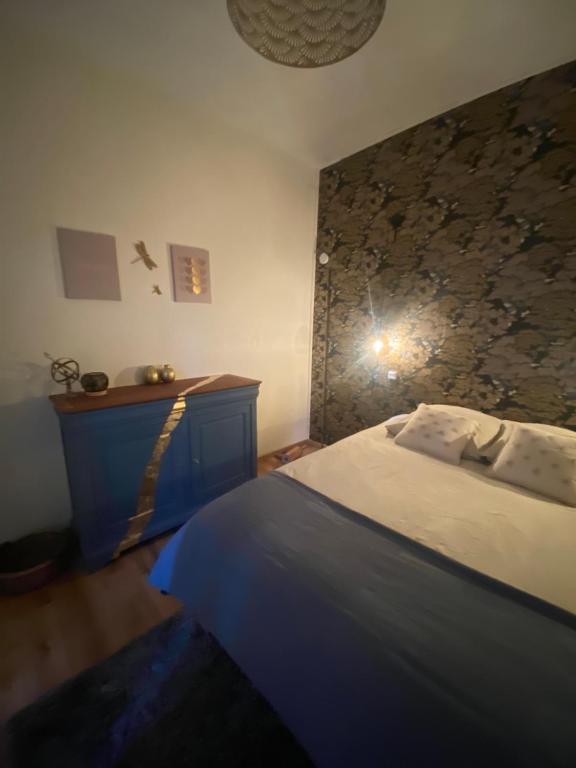Postel nebo postele na pokoji v ubytování Une Ferme en Ville