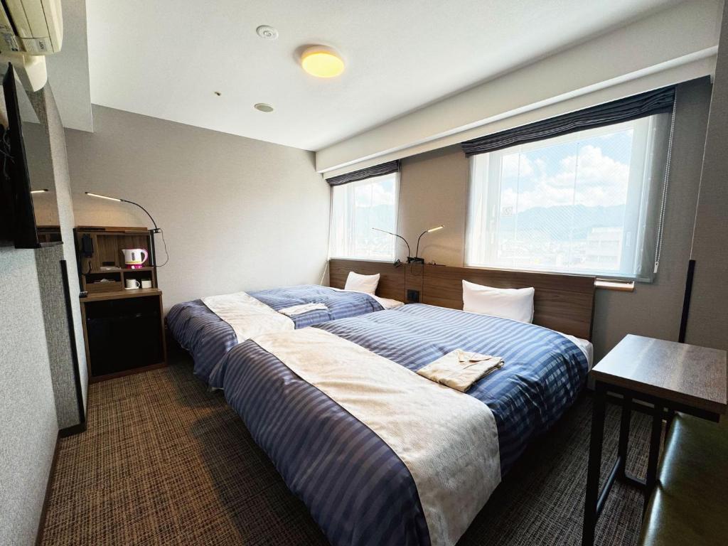 Postel nebo postele na pokoji v ubytování Hotel Arstainn