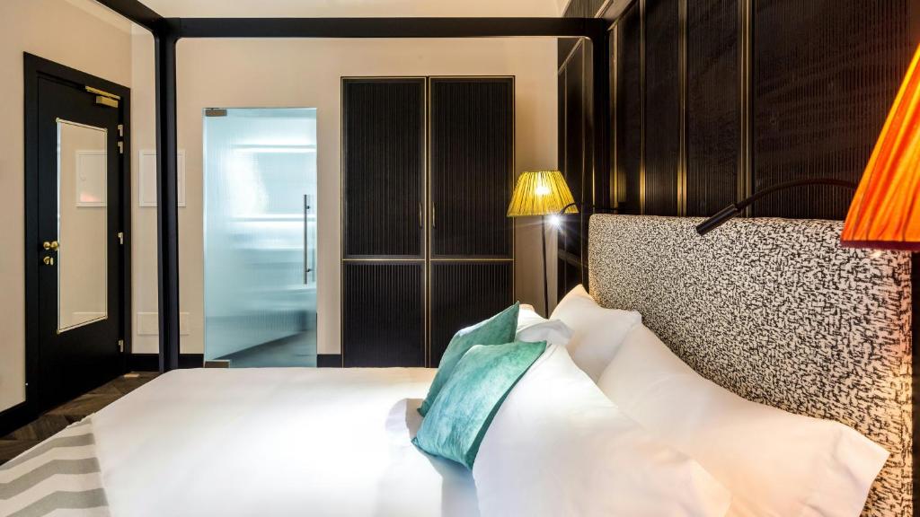 Postel nebo postele na pokoji v ubytování Hotel The Haven Roma