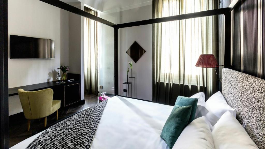 Postel nebo postele na pokoji v ubytování Hotel The Haven Roma