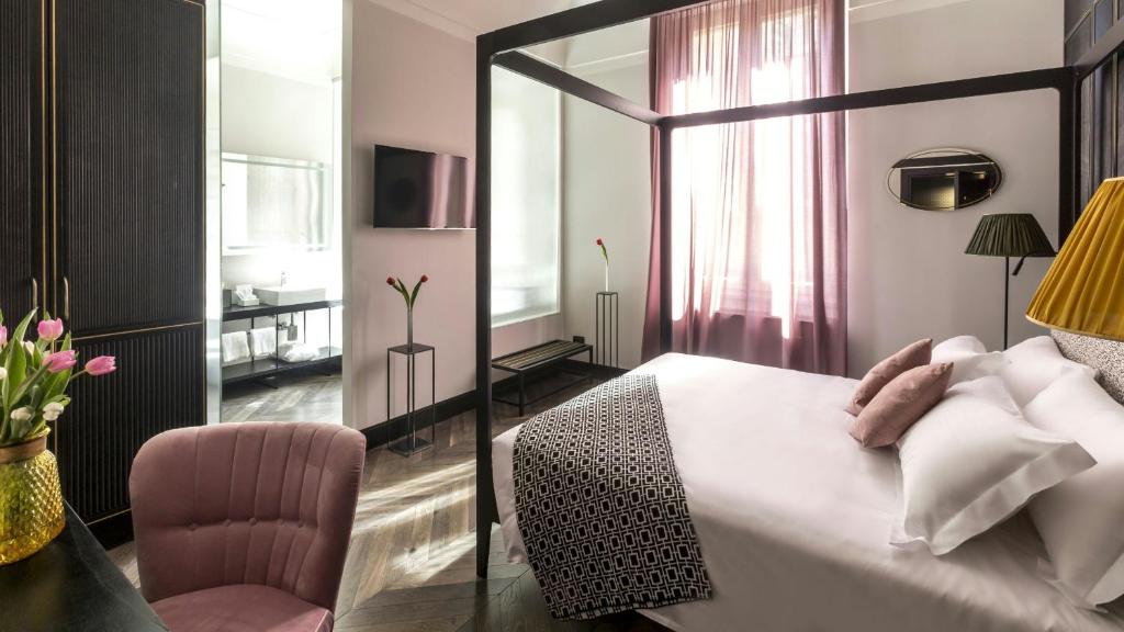 Postel nebo postele na pokoji v ubytování Hotel The Haven Roma