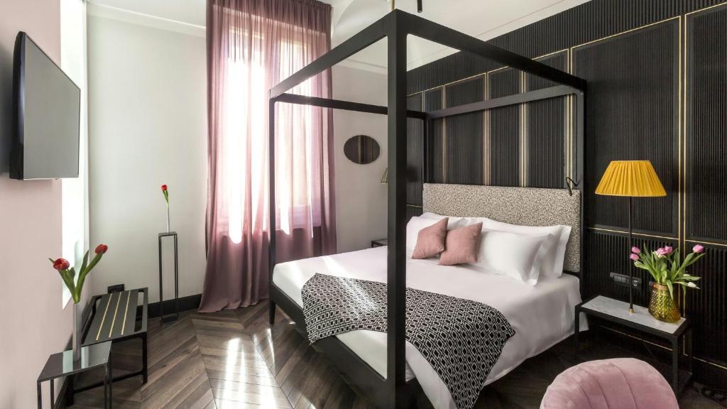 Postel nebo postele na pokoji v ubytování Hotel The Haven Roma