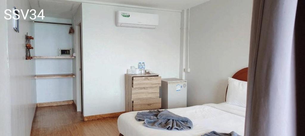 A bed or beds in a room at Phi Phi Cozy Seafront Resort