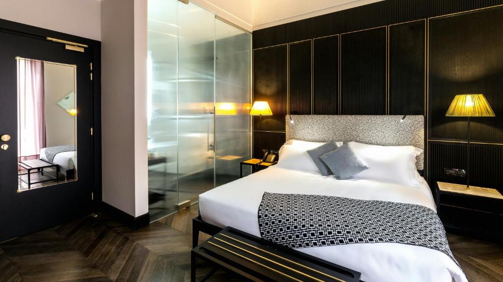 Postel nebo postele na pokoji v ubytování Hotel The Haven Roma