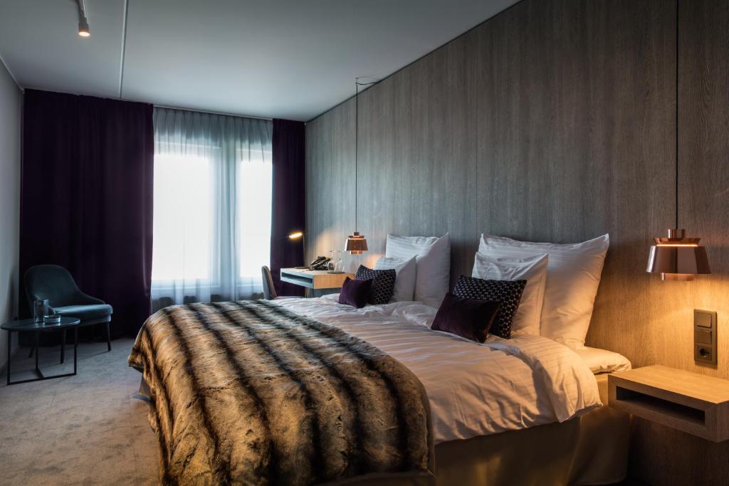Postel nebo postele na pokoji v ubytování KUST Hotell & SPA
