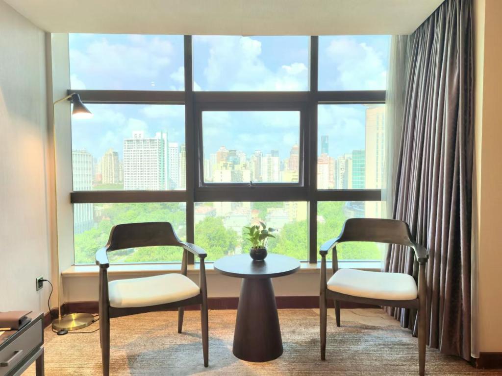 Posezení v ubytování Jin Jiang Pine City Hotel