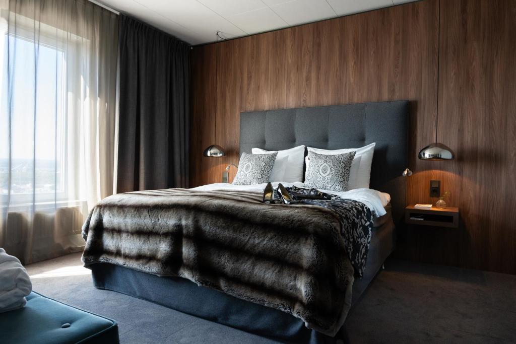 Postel nebo postele na pokoji v ubytování KUST Hotell & SPA