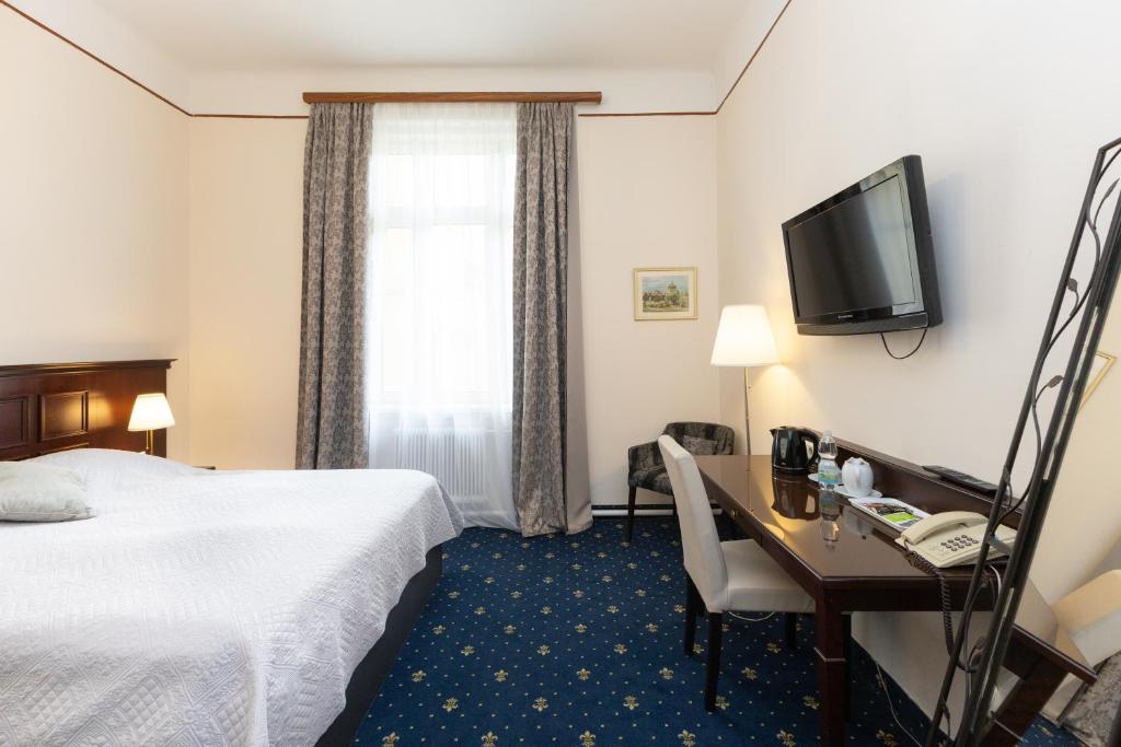 Voodi või voodid majutusasutuse Hotel Viktoria Schönbrunn toas