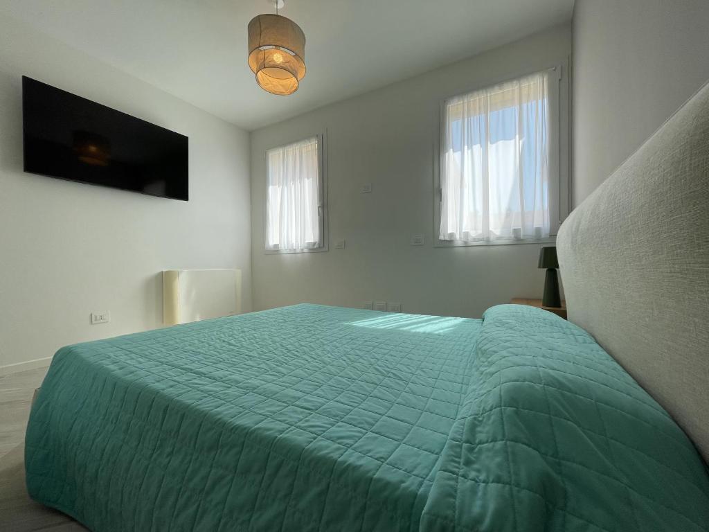 A bed or beds in a room at Gli Scogli Luxury Residence Hotel