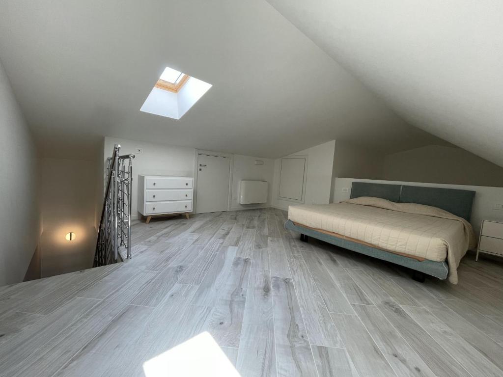 A bed or beds in a room at Gli Scogli Luxury Residence Hotel