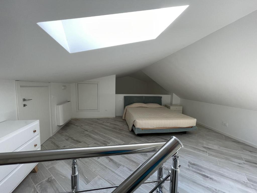 A bed or beds in a room at Gli Scogli Luxury Residence Hotel
