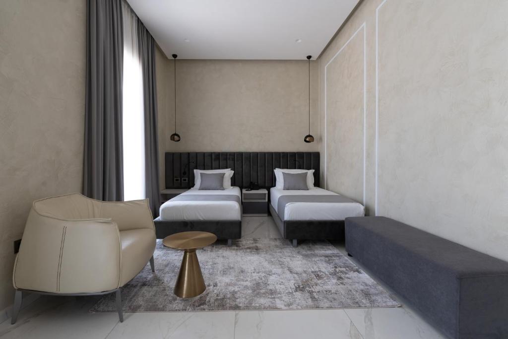 Postel nebo postele na pokoji v ubytování Hotel Plaza Berat
