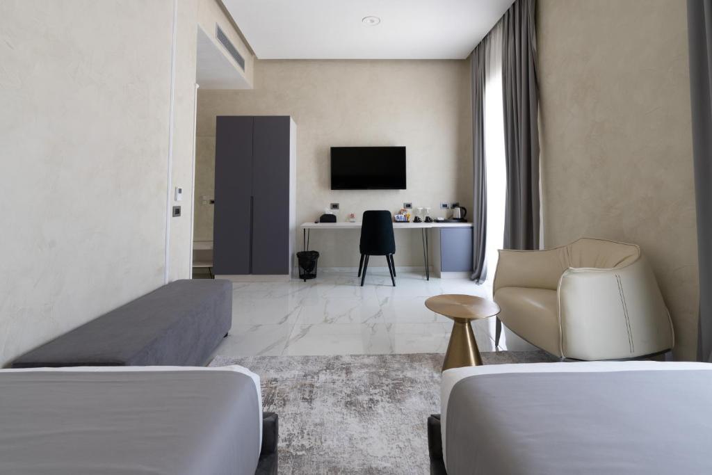 TV a/nebo společenská místnost v ubytování Hotel Plaza Berat