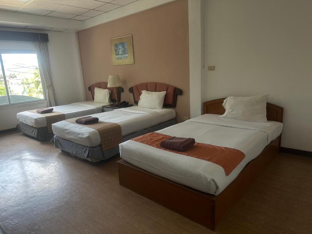 Postel nebo postele na pokoji v ubytování Orchid Residence Samui