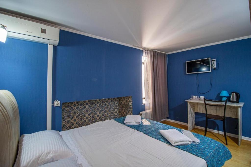Postel nebo postele na pokoji v ubytování HotelHarmony