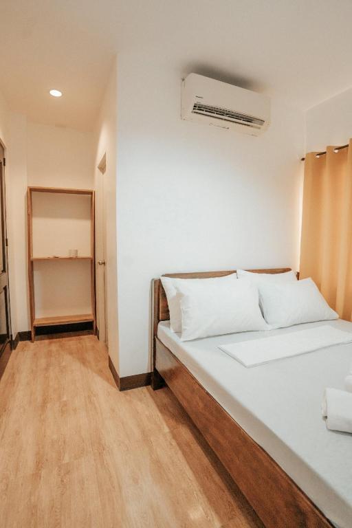 Postel nebo postele na pokoji v ubytování Sonora's Inn, Coron