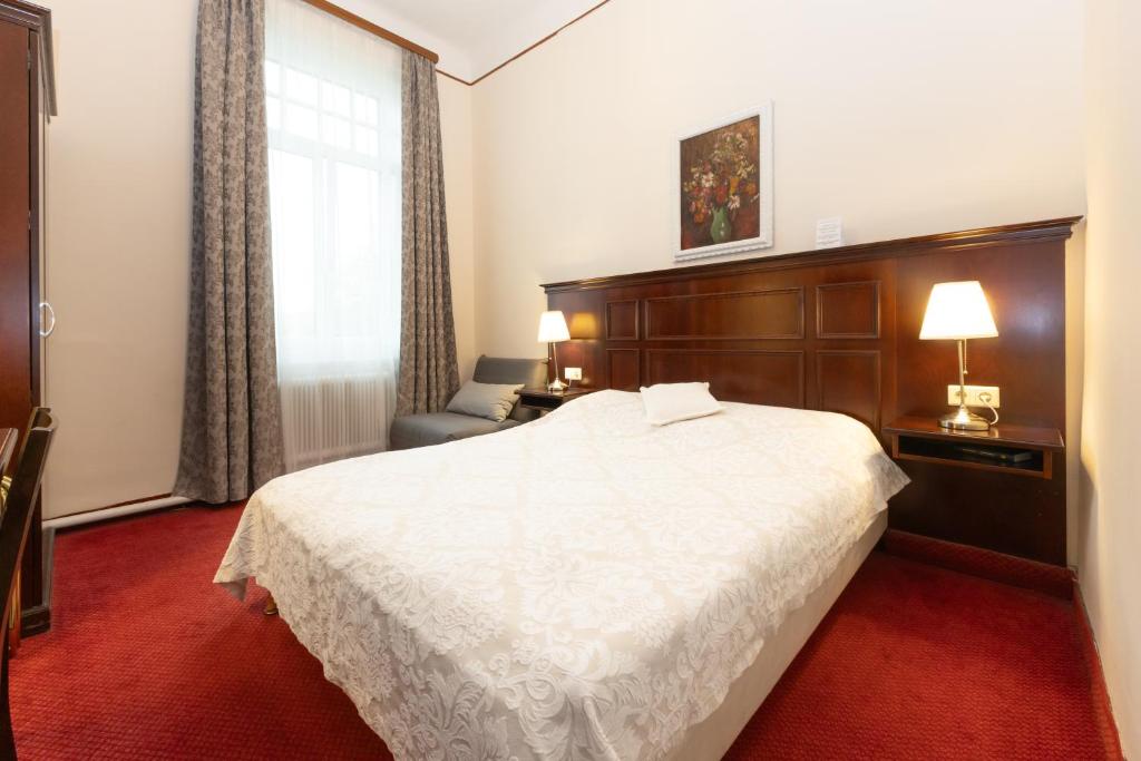 Voodi või voodid majutusasutuse Hotel Viktoria Schönbrunn toas