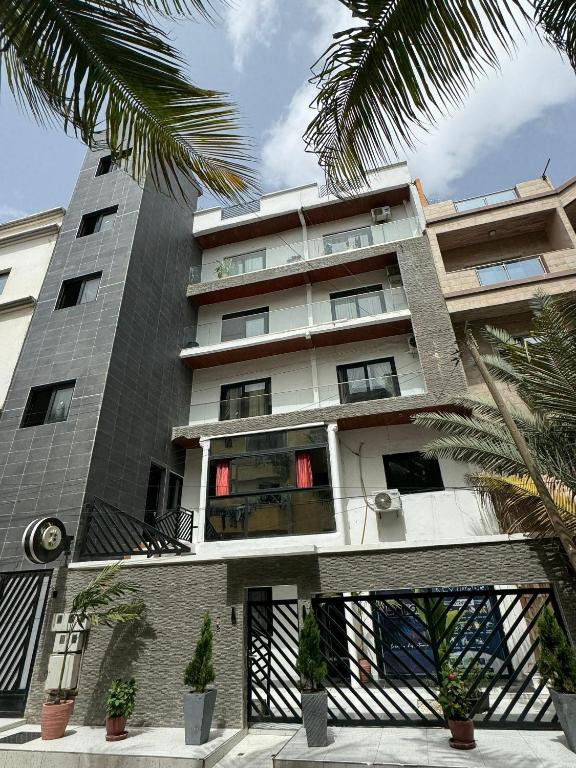 App Résidence Amadou et Coumba - Appartement Trois Chambres