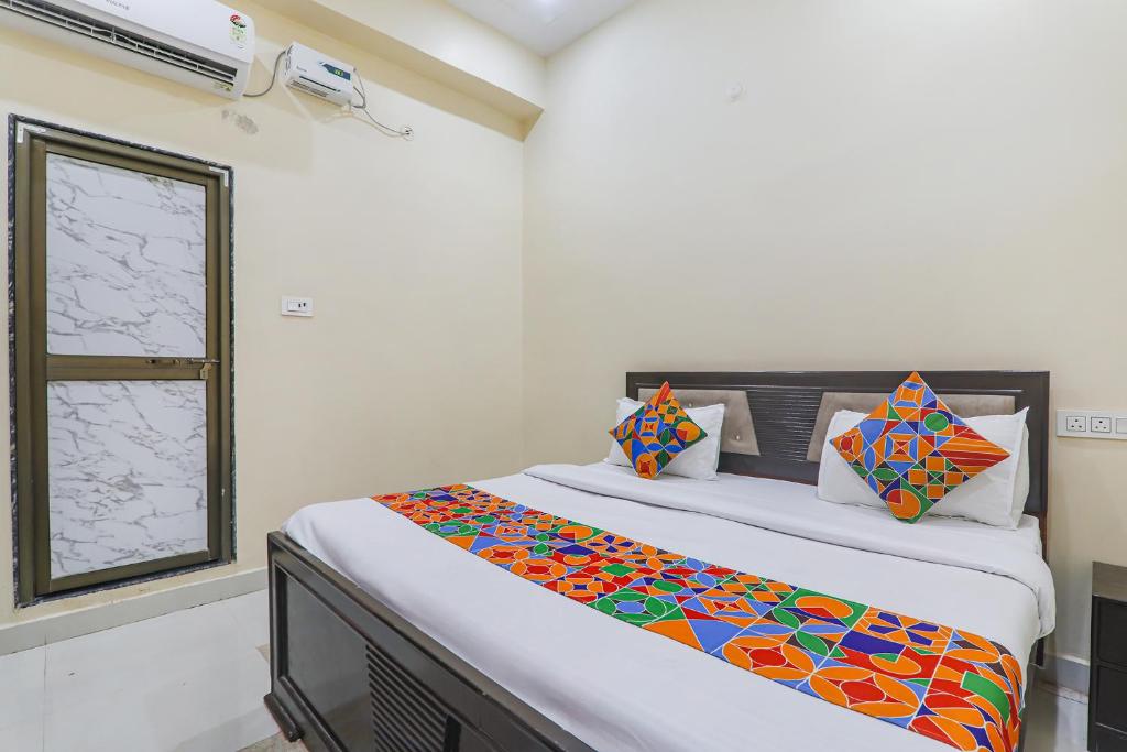 Letto o letti in una camera di FabExpress Saryu
