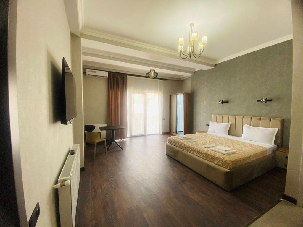 Postel nebo postele na pokoji v ubytování Hotel Garden