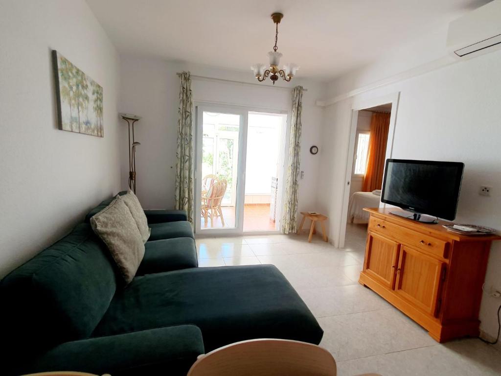 TV a/nebo společenská místnost v ubytování Enjoy Torrox