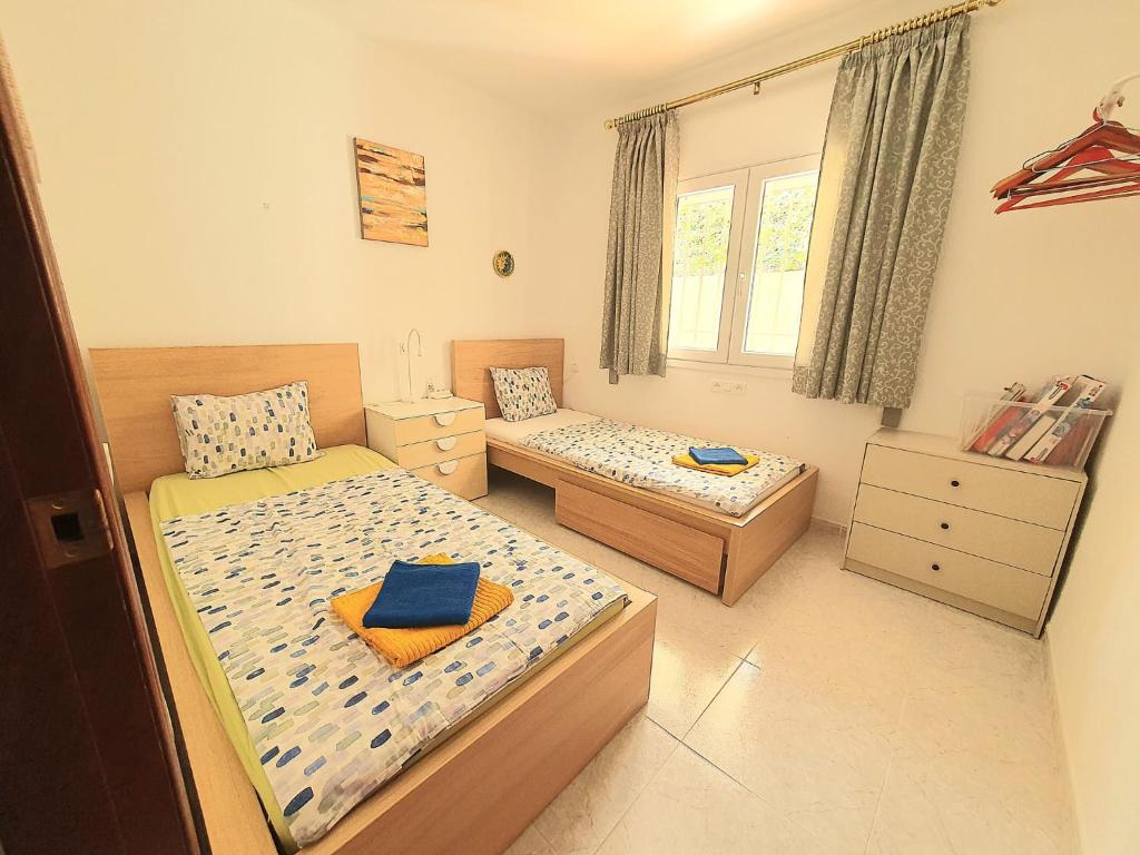 Postel nebo postele na pokoji v ubytování Enjoy Torrox
