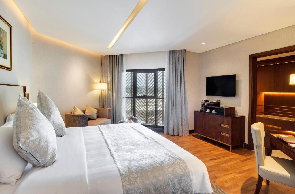 The Oberoi Madina المدينة أوبروي tesisinde bir odada yatak veya yataklar