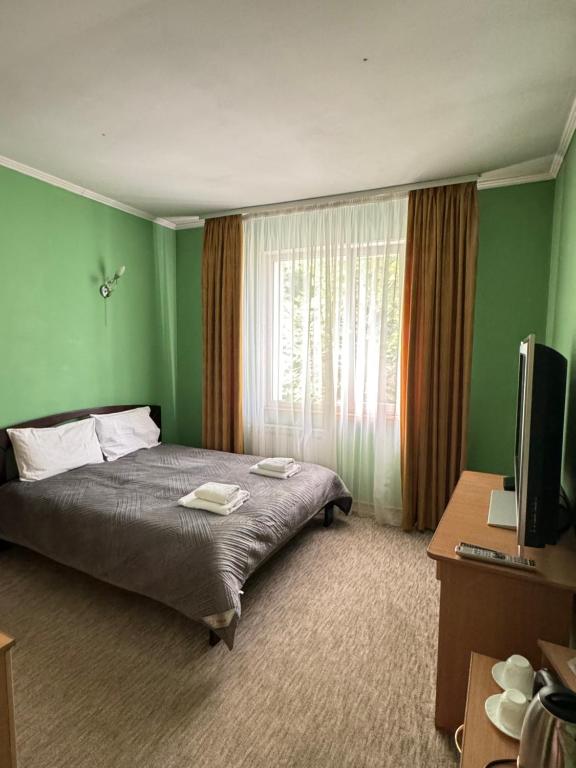Postel nebo postele na pokoji v ubytování Лелеч