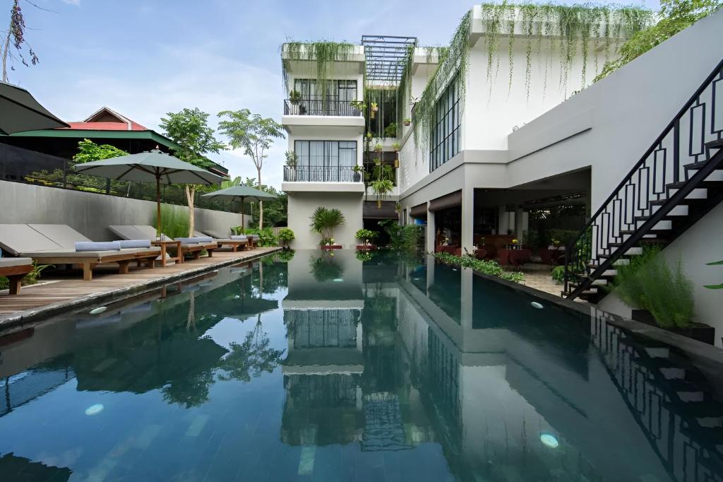 an image of a swimming pool at a hotel at Vihara The City of Temples in Siem Reap