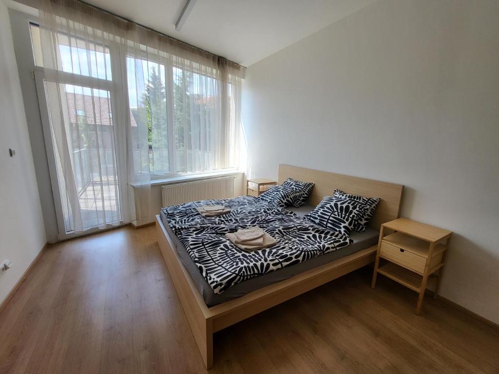 Postel nebo postele na pokoji v ubytování Rezidence - Vídeňská