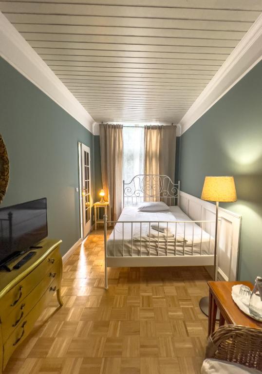 Postel nebo postele na pokoji v ubytování Hotel-Maison Am Olivaer Platz