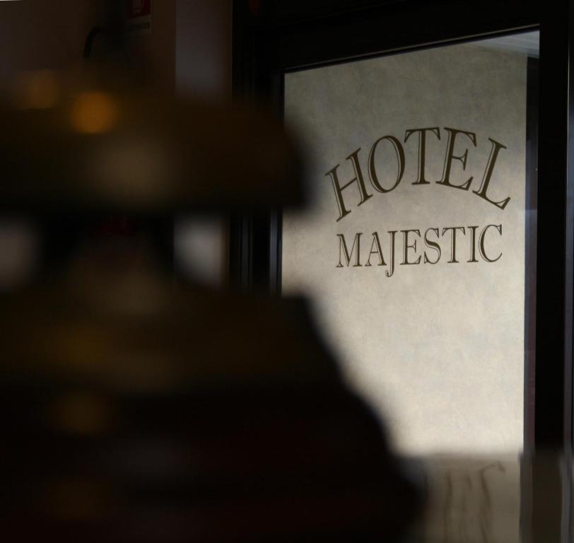 a sign that reads hotel masic on a building at Hotel Majestic in San Giuliano Milanese