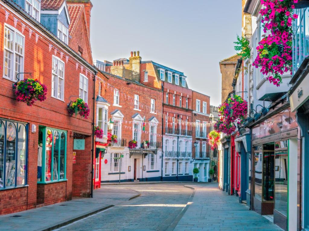 an empty street in a city with buildings at The White Hart Hotel Lincoln in Lincoln