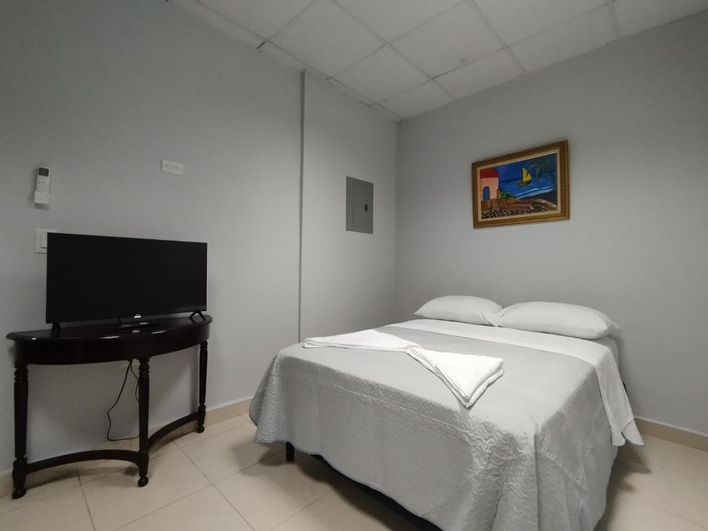 TV a/nebo společenská místnost v ubytování Apartamentos Marconela