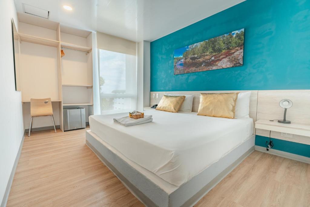 Postel nebo postele na pokoji v ubytování Hotel Quinto Nivel