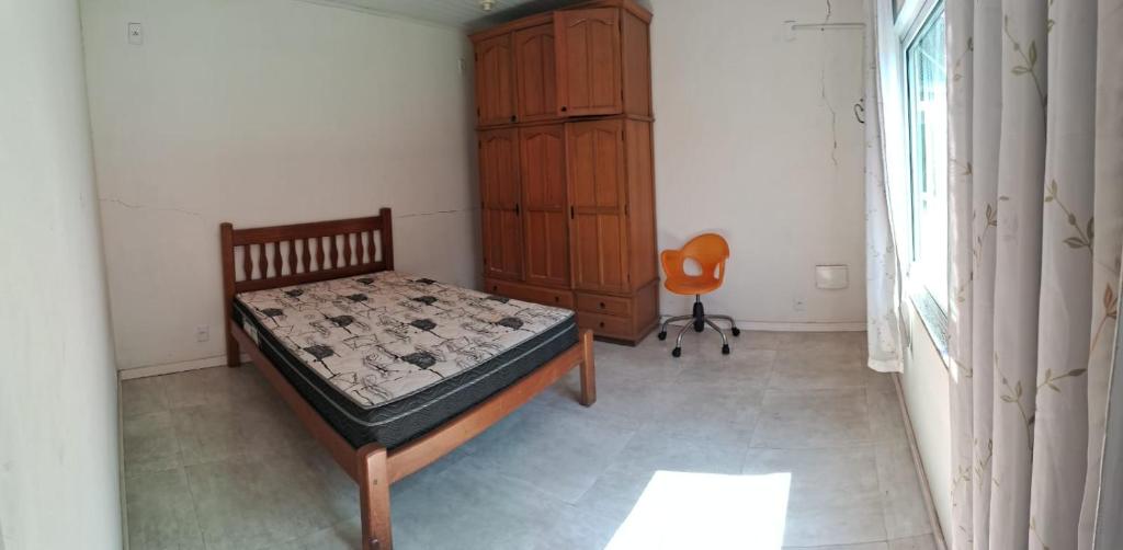 Ένα ή περισσότερα κρεβάτια σε δωμάτιο στο Kitnet em Jacarepaguá ROCK IN RIO