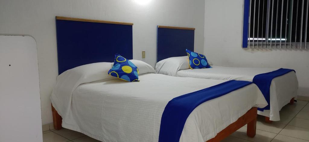 Postel nebo postele na pokoji v ubytování Hotel Vagabundo Expo Guadalajara