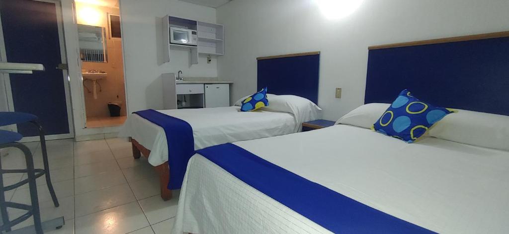 Postel nebo postele na pokoji v ubytování Hotel Vagabundo Expo Guadalajara